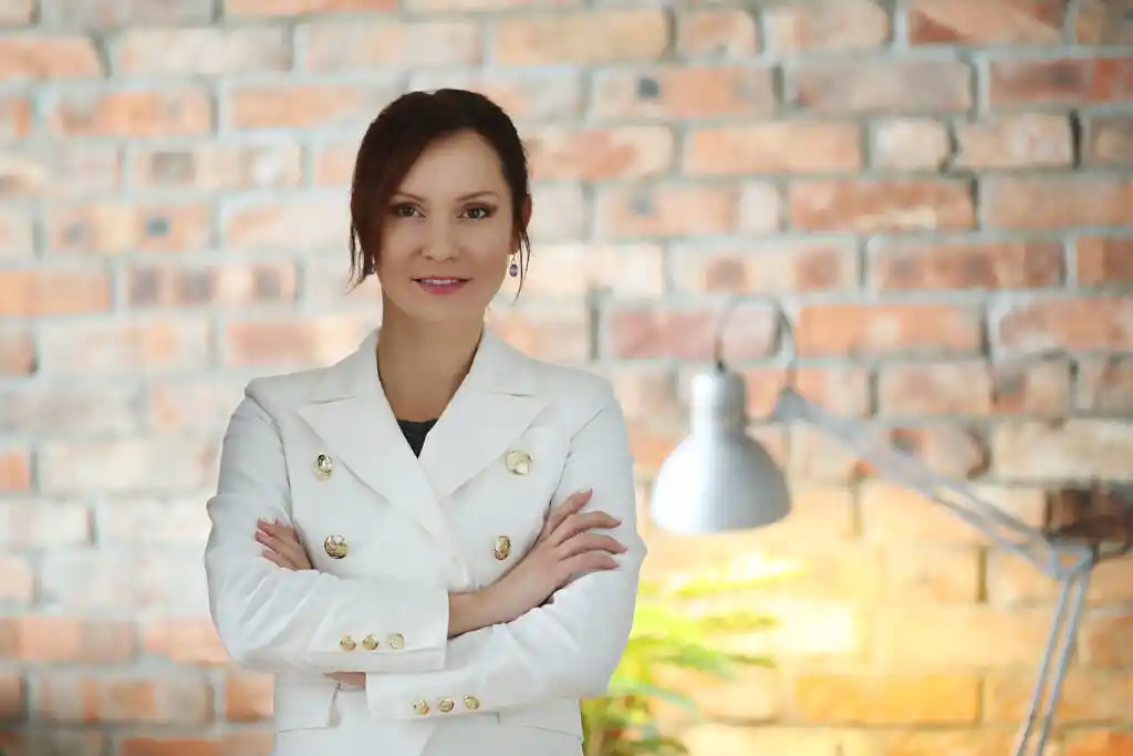 Business woman in suit with arms crossed