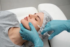 High angle of lip filler injections on client