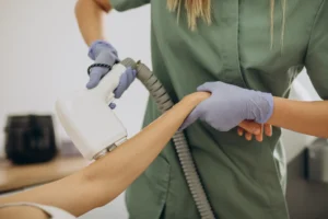 Patient getting laser hair removal on arm