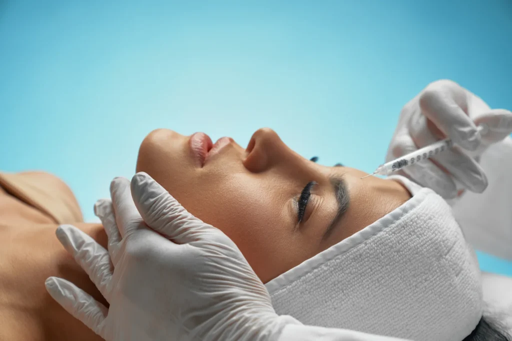 Patient sitting on back getting botox injections