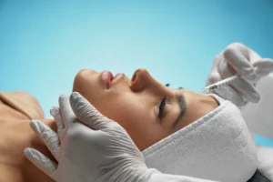 Patient sitting on back getting botox injections