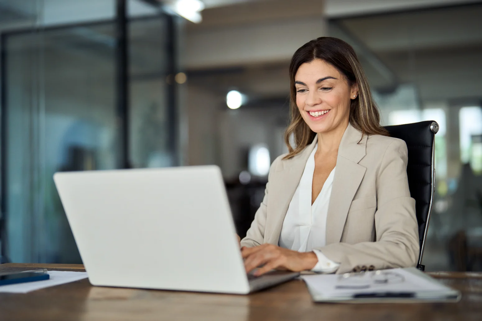 Woman happy at work after minimal downtime from Morpheus8